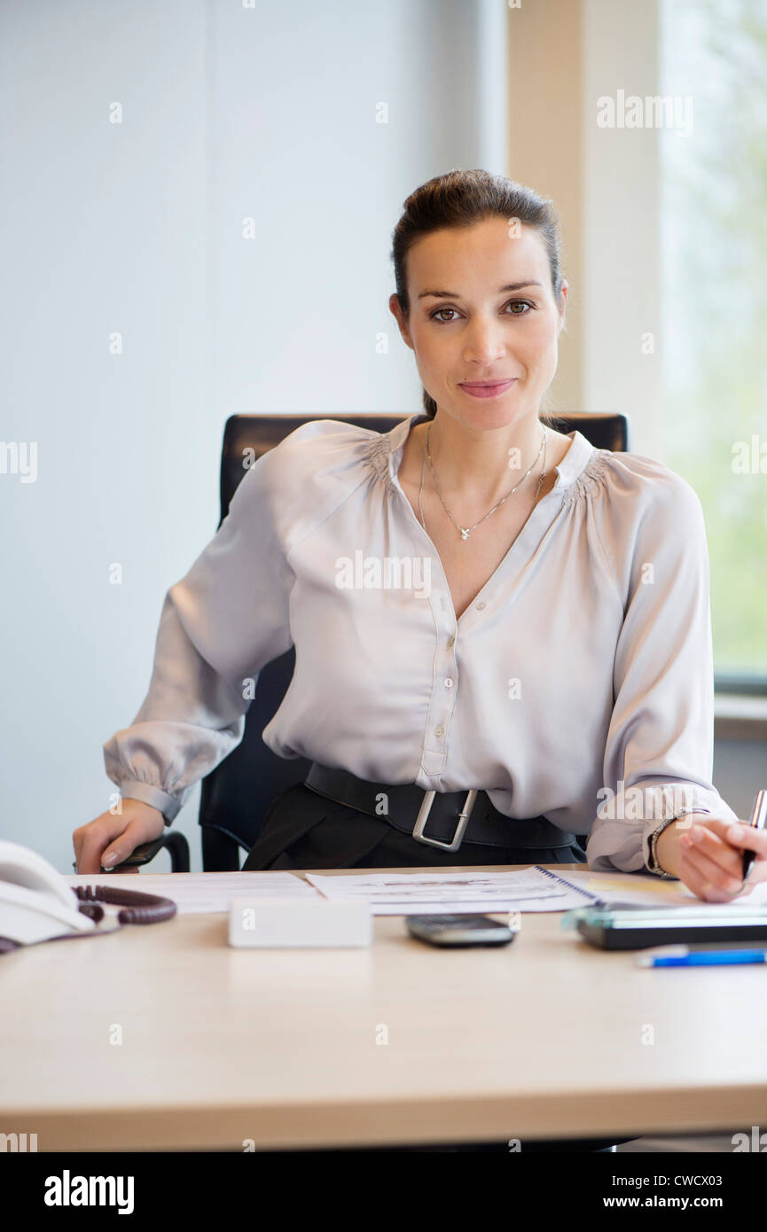 Portrait of a businesswoman working in an office Stock Photo - Alamy
