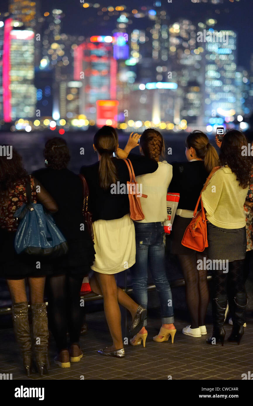 Young women looking at the night skyline, Hong Kong SAR Stock Photo - Alamy