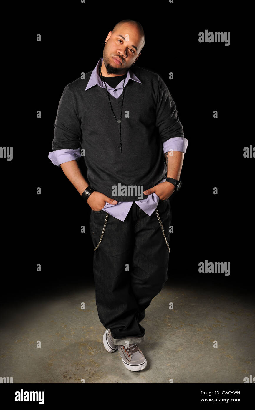 African American hip hop man standing over dark background Stock Photo