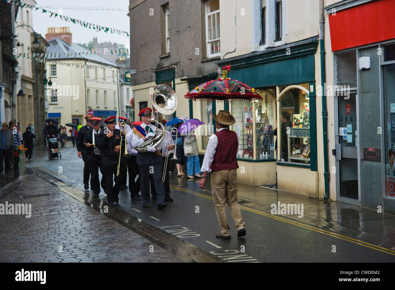 Adamant New Orleans Marching Jazz Band parade through streets in the