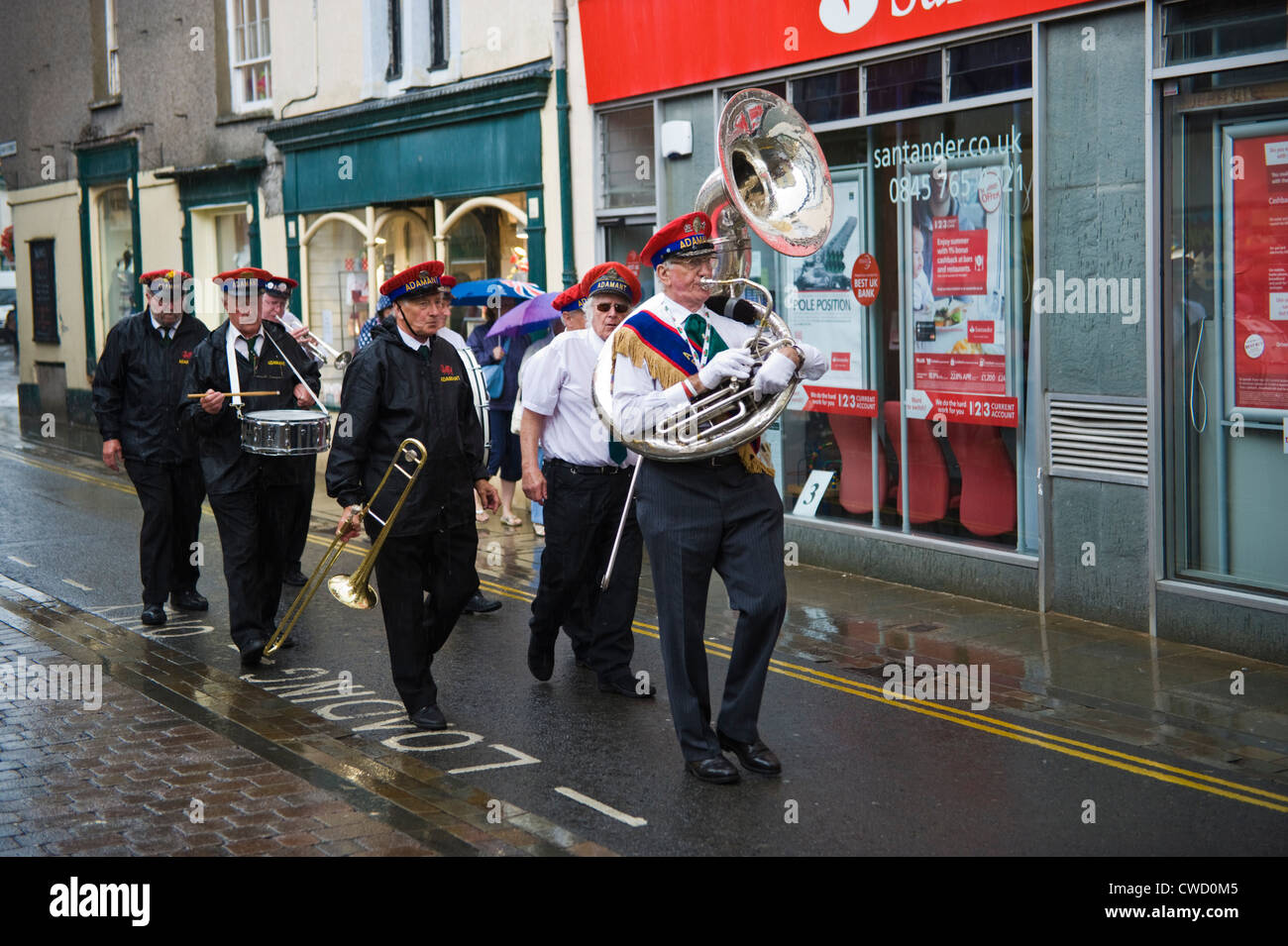 Adamant New Orleans Marching Jazz Band parade through streets in the