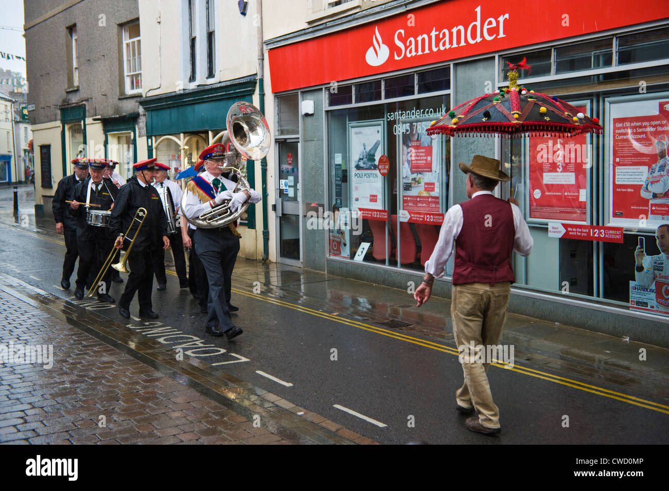 Adamant New Orleans Marching Jazz Band parade through streets in the