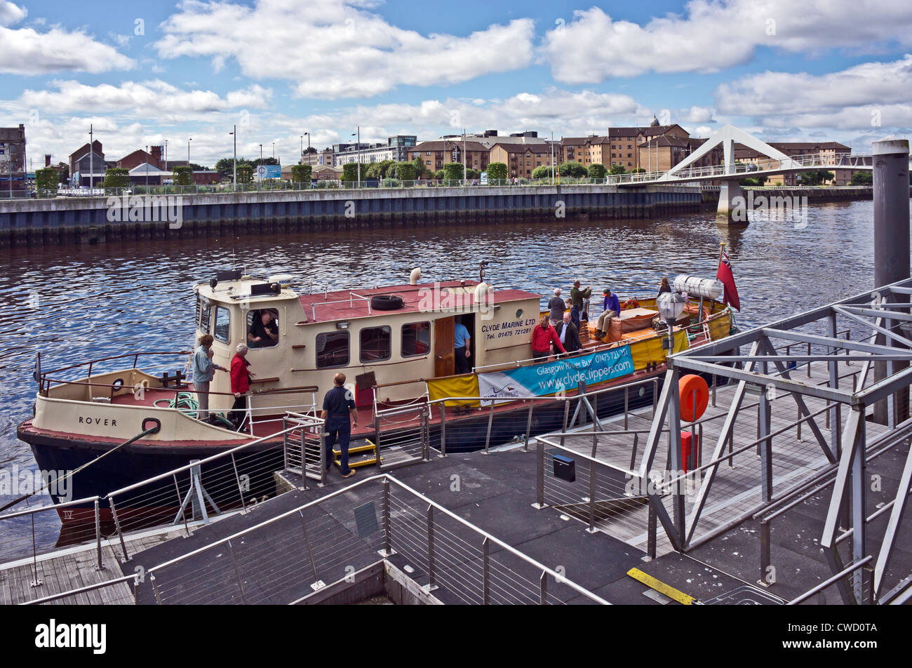Clyde Marine Ltd. vessel Rover discharging passengers at the Broomielaw pontoon on the River Clyde in central Glasgow Scotland Stock Photo