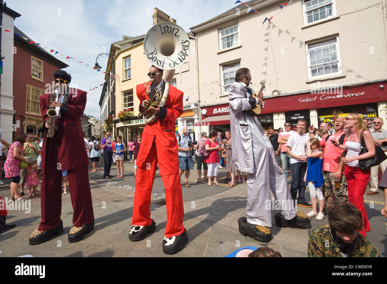 The Iron Boot Scrapers street performers on stilts entertaining the