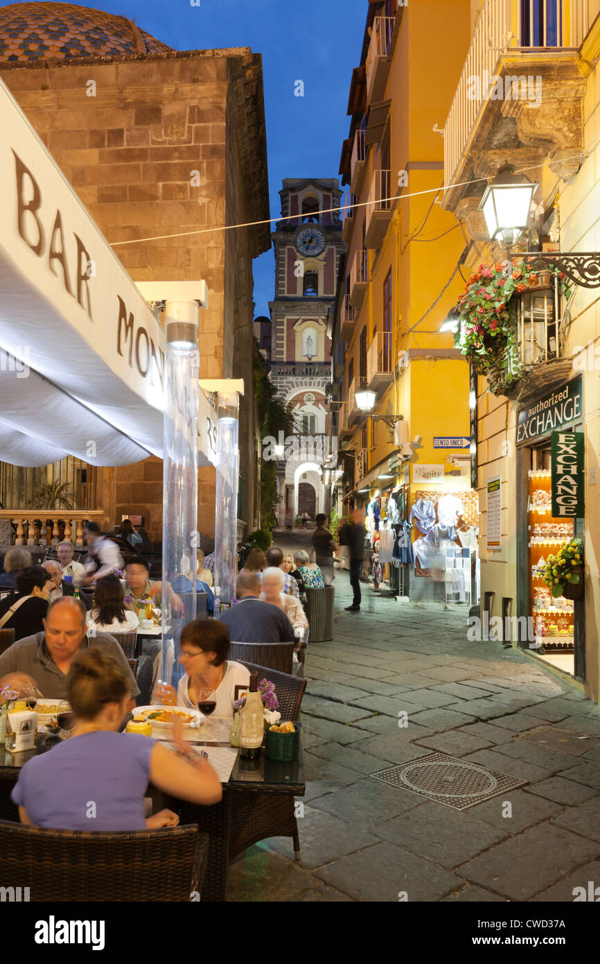 Evening restaurant scene on the Via San Cesareo with the Campanile de la Cattedrale Stock Photo