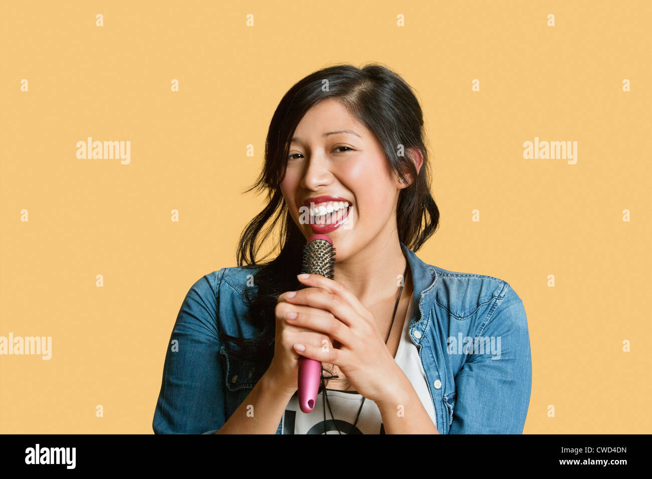 Person Singing With A Hairbrush High Resolution Stock Photography and ...