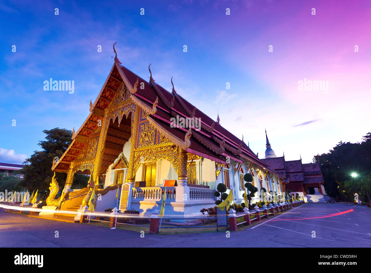 Wat Phra Singh temple at sunset in Chiang Mai, Thailand. Stock Photo
