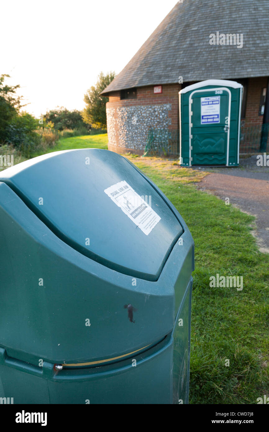 dog waste disposal bin and humanportable temporary toilet Stock Photo