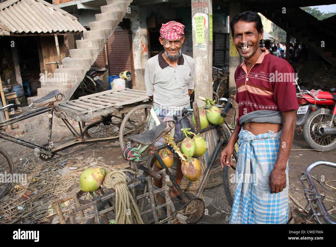 Selling a coconut on  market in Kumrokhali, West Bengal, India on January 12, 2009. Stock Photo