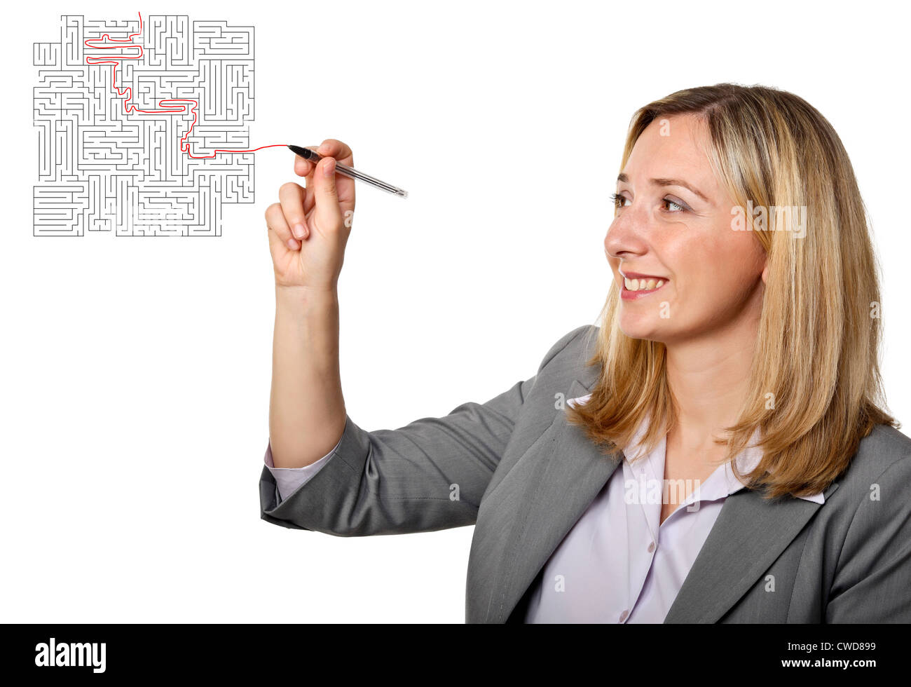 smiling woman with pen and maze Stock Photo