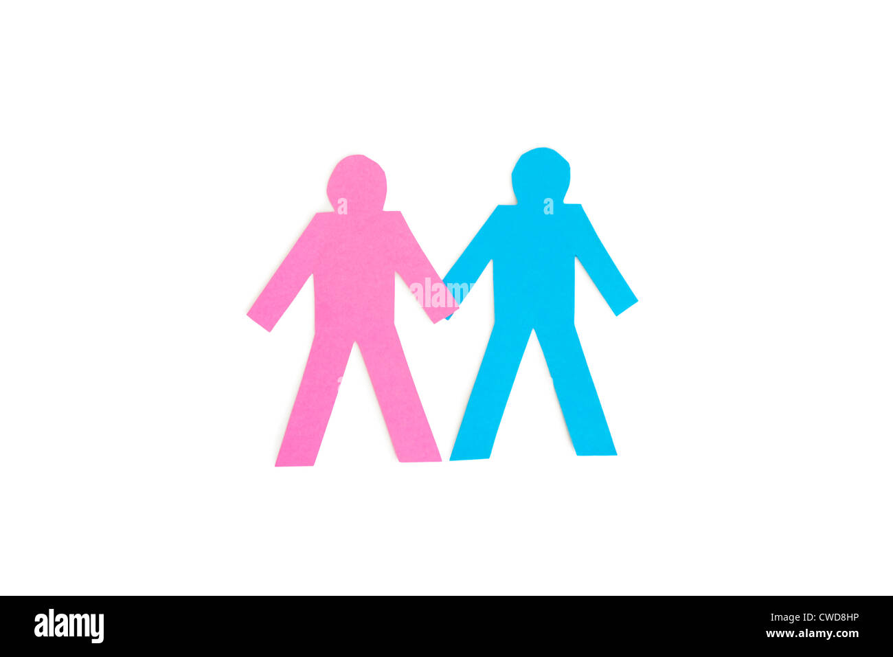 Paper cut out figures holding hands over white background Stock Photo