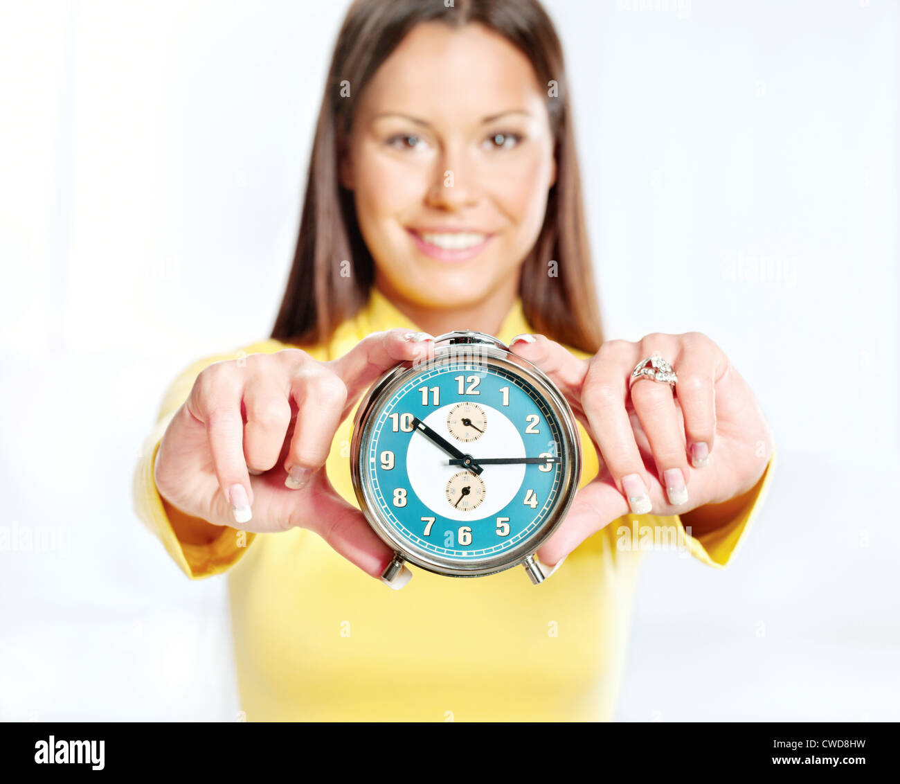analog alarm clock and woman Stock Photo