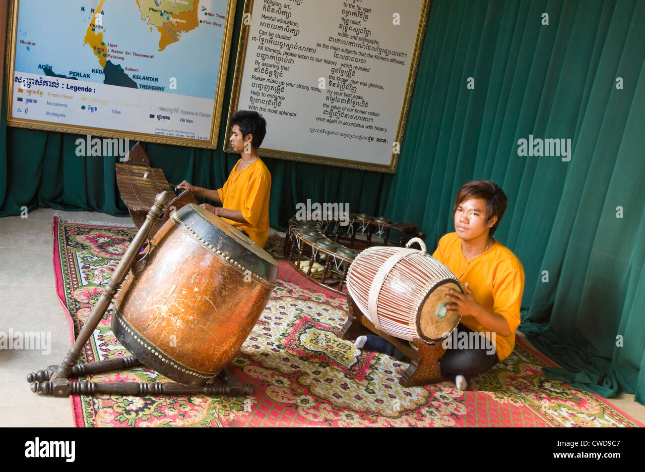 Horizontal view of musicians playing traditional Cambodian instruments, the roneat or wooden xylophone and the skor arak drum. Stock Photo