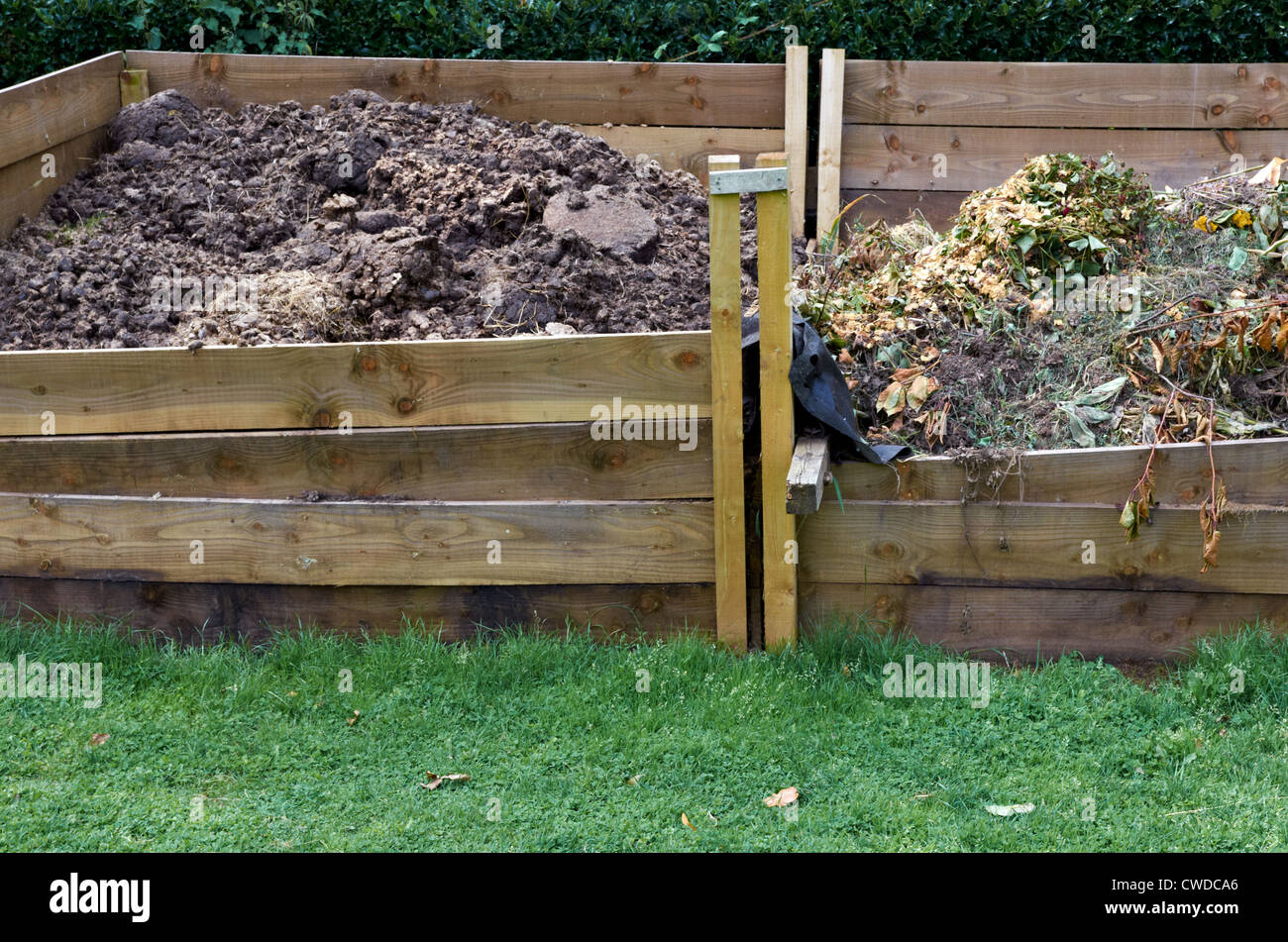 https://c8.alamy.com/comp/CWDCA6/large-garden-compost-bins-CWDCA6.jpg