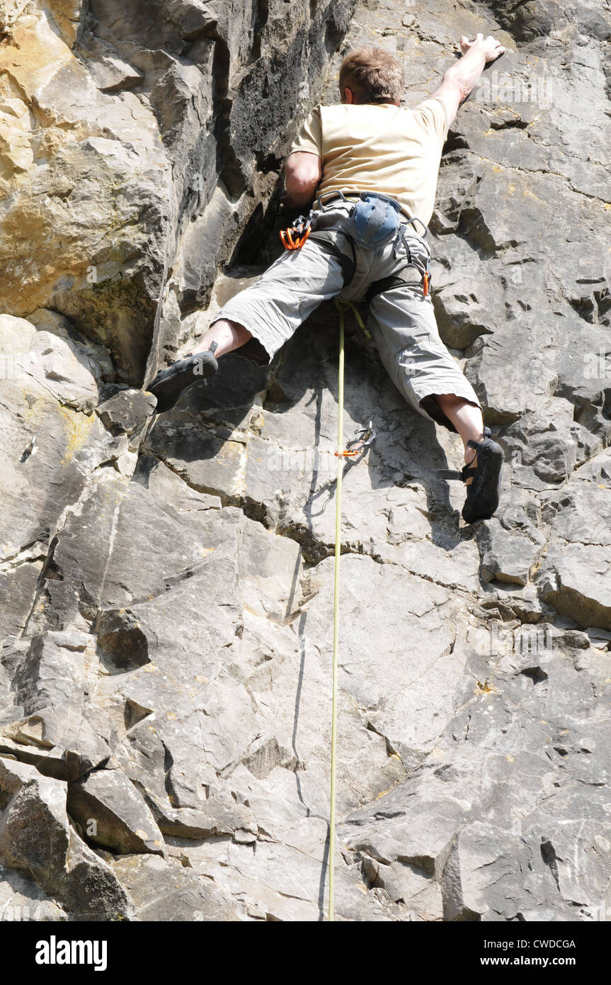 Man climbing the mountain with protection equipment Stock Photo Alamy