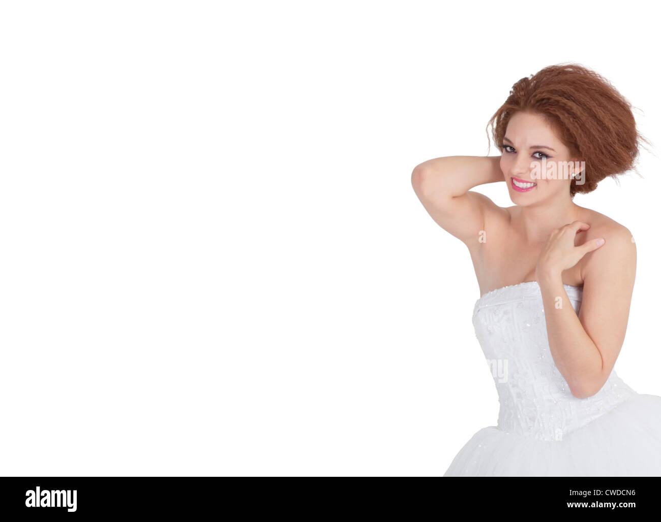 Portrait of smiling young brunette posing over white background Stock ...