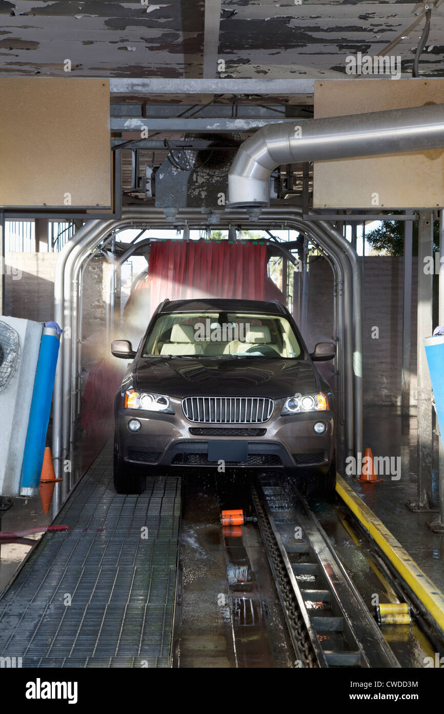 Motor vehicle passing through car wash Stock Photo