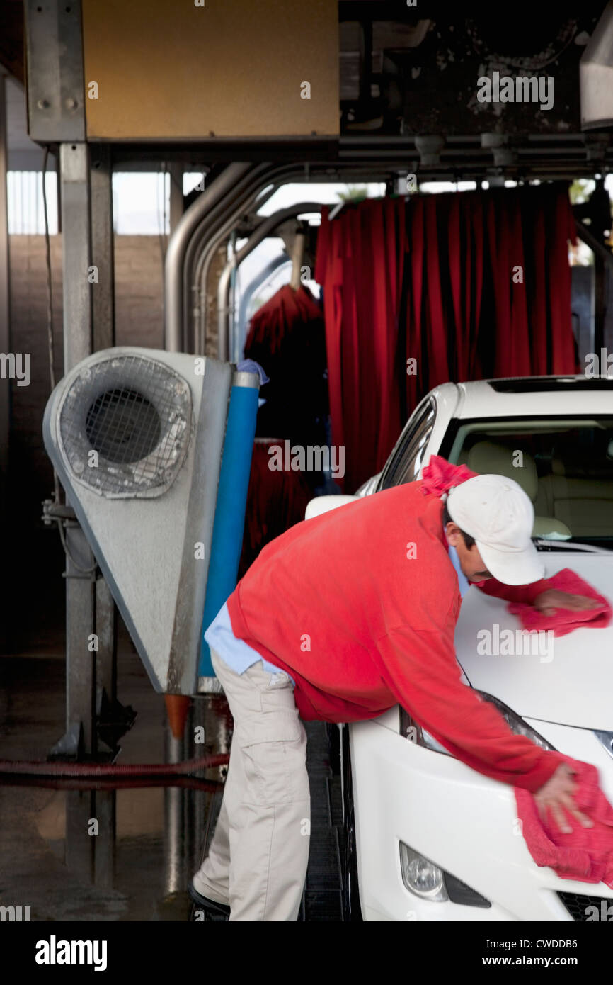 Employee wiping vehicle after washing in car wash Stock Photo Alamy
