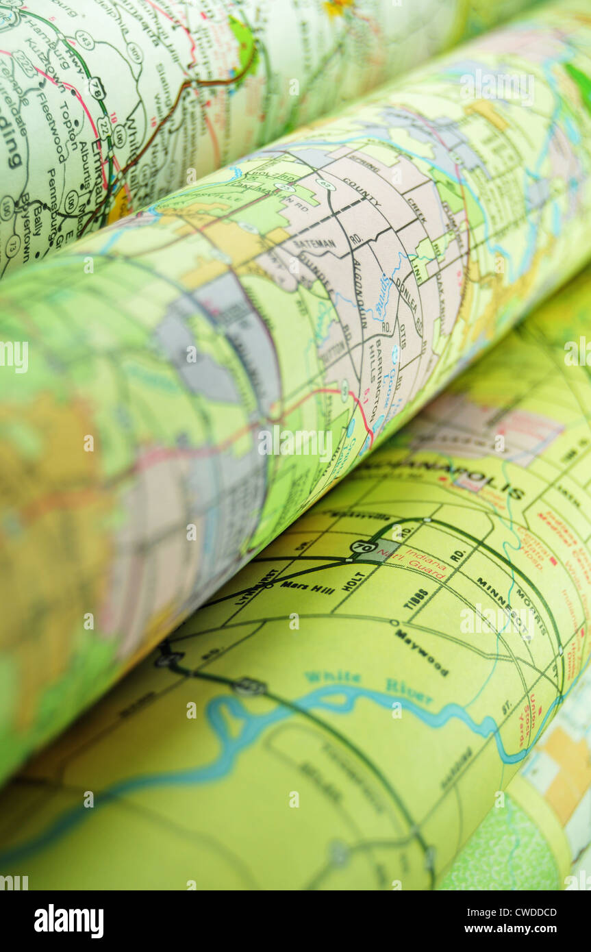 Various colorful road maps folded Stock Photo Alamy