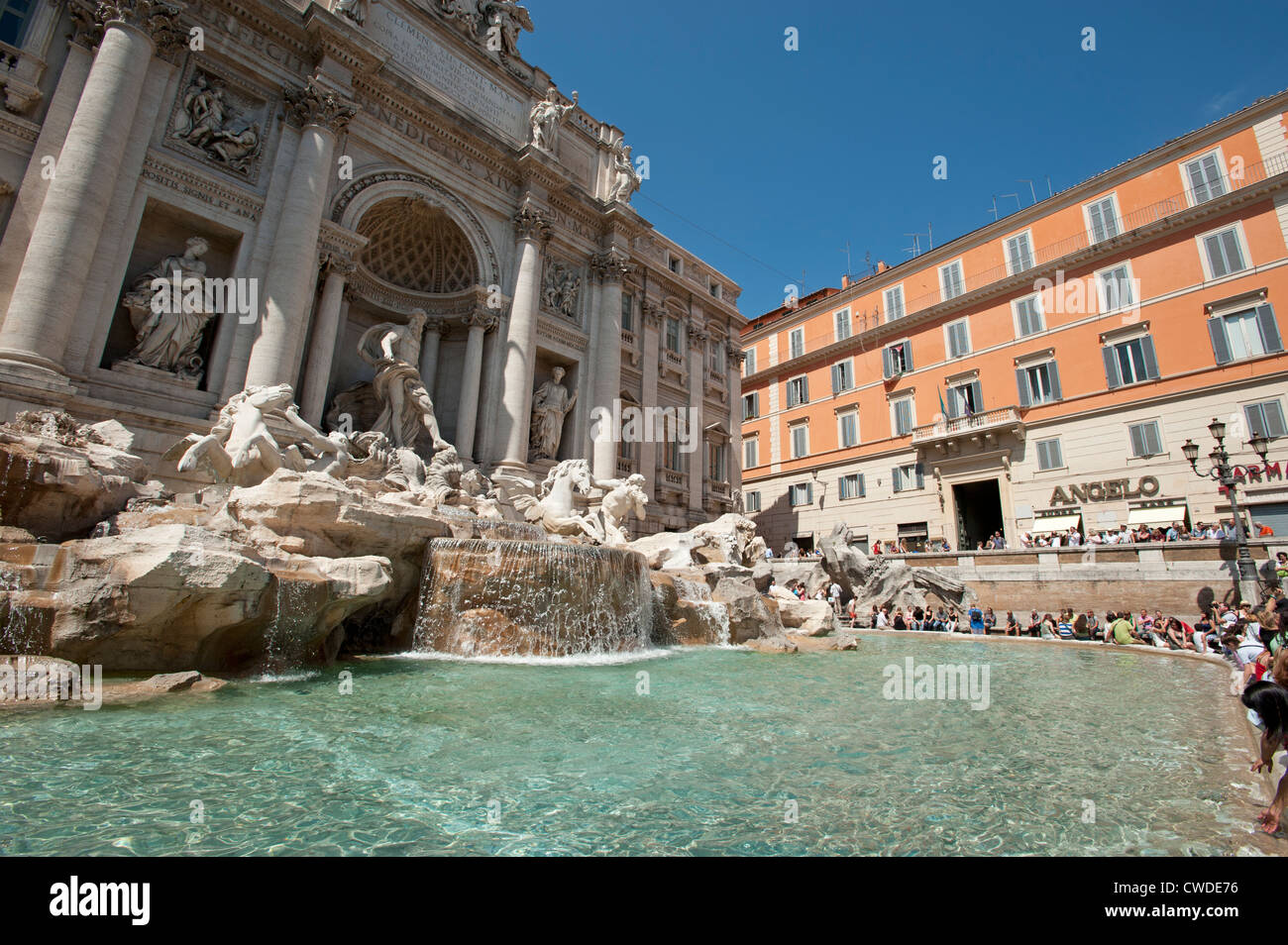 Tourists make a wish and take pictures at the Trevi Fountain Rome Italy Stock Photo