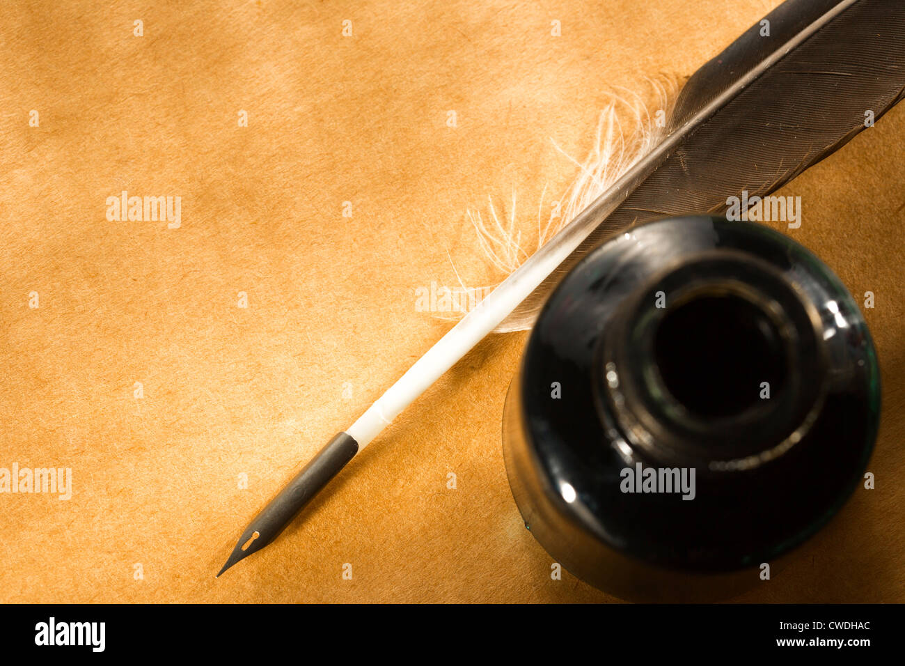 Feather ink bottle on paper Stock Photo Alamy