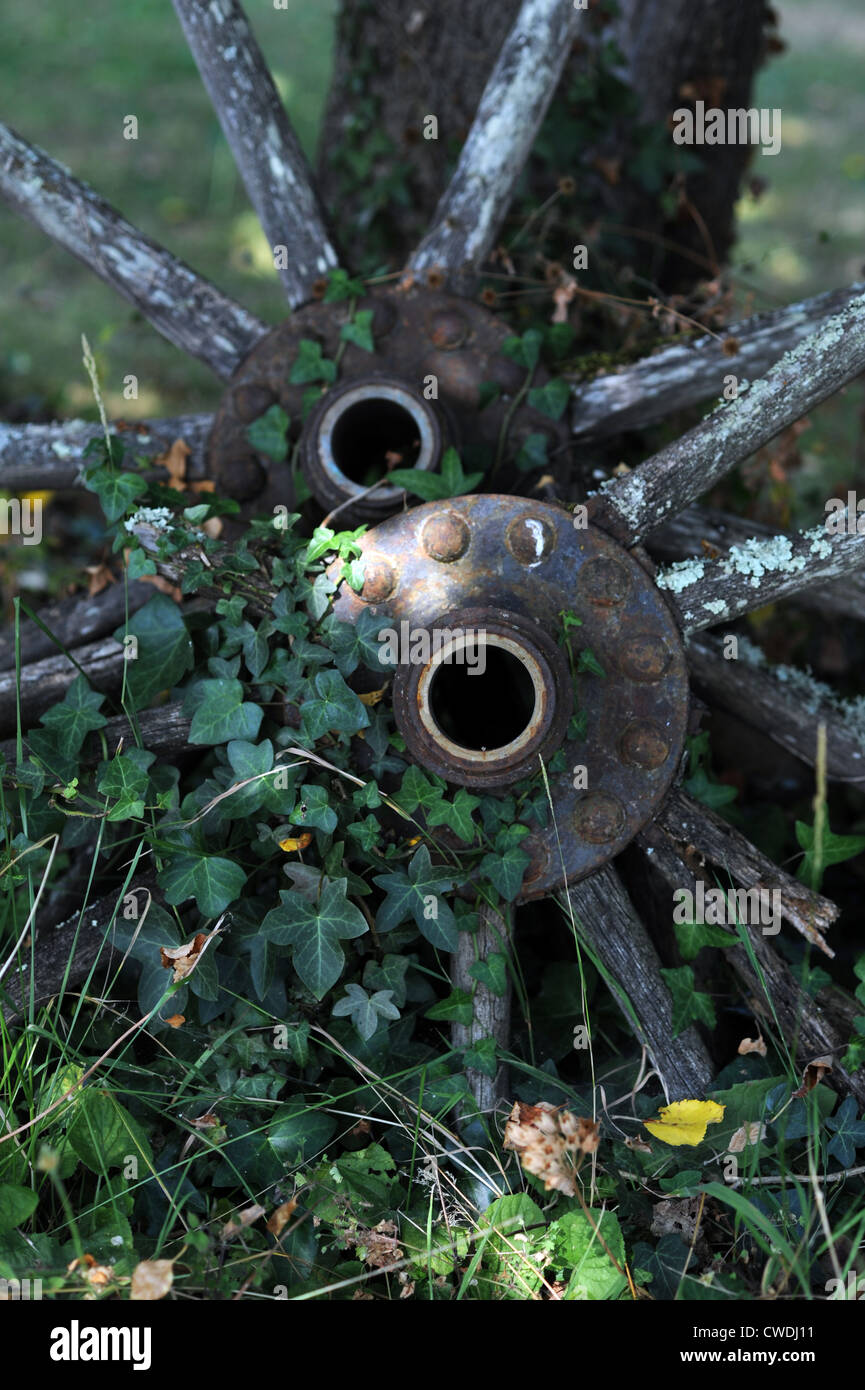 Old wooden wheels and spokes falling to pieces on a farm in the Lot Region of South West France Europe  Photo Simon Dack 2012 Stock Photo