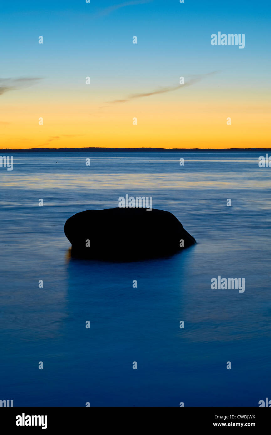 Boulder in ocean water, Maine, USA Stock Photo