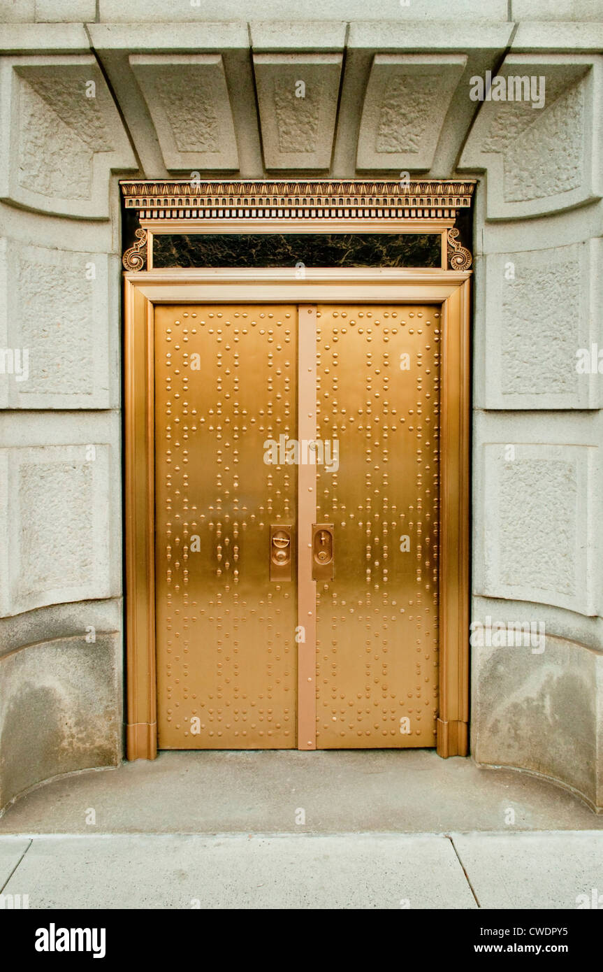 A pair of gold doors beckons the viewer to enter and see the luxuries and wonders inside. Stock Photo