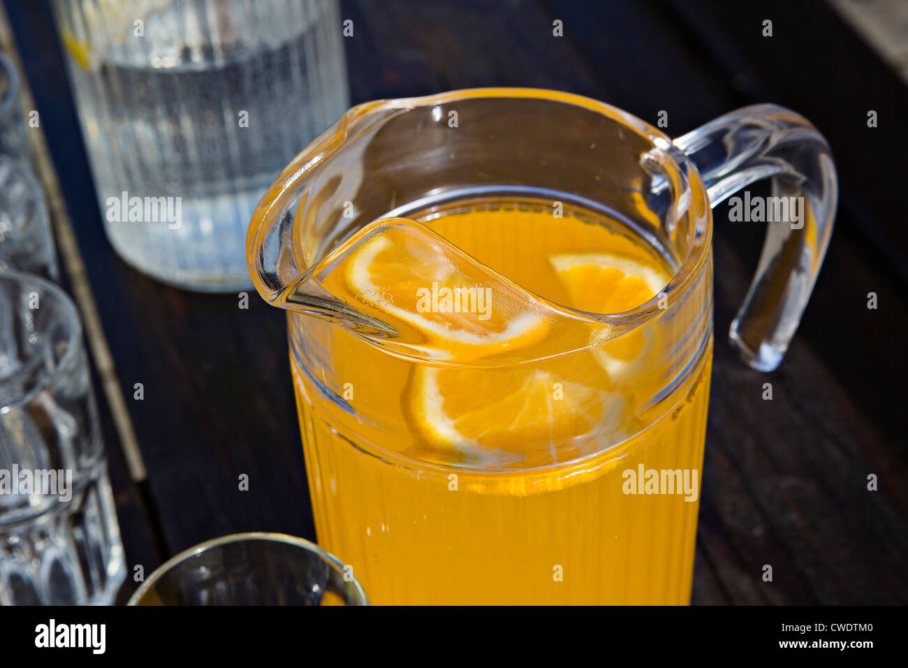 Juice of orange is on dark painted table Stock Photo: 50091888 - Alamy