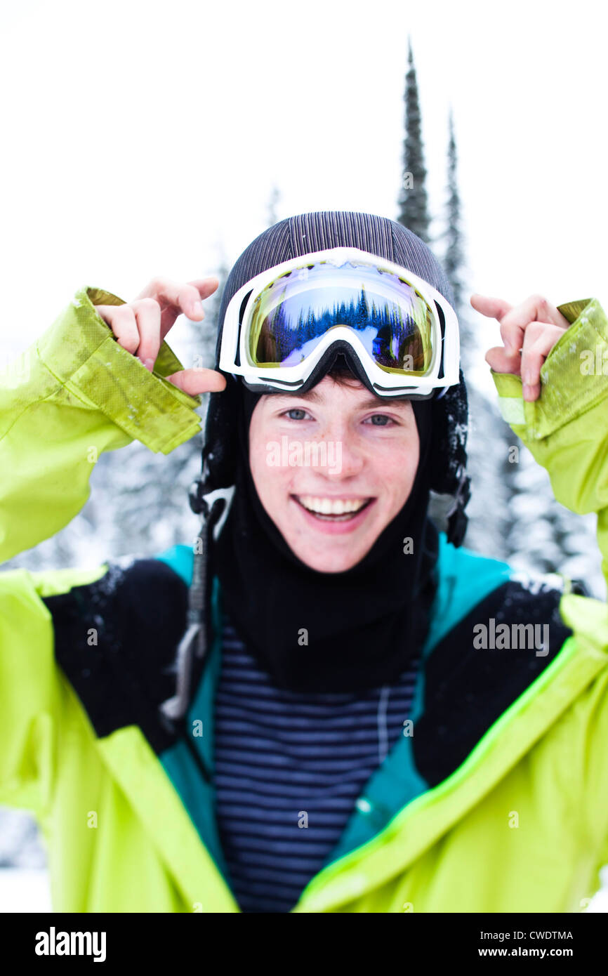 A happy young man smiles while taking a break from skiing in Idaho. Stock Photo