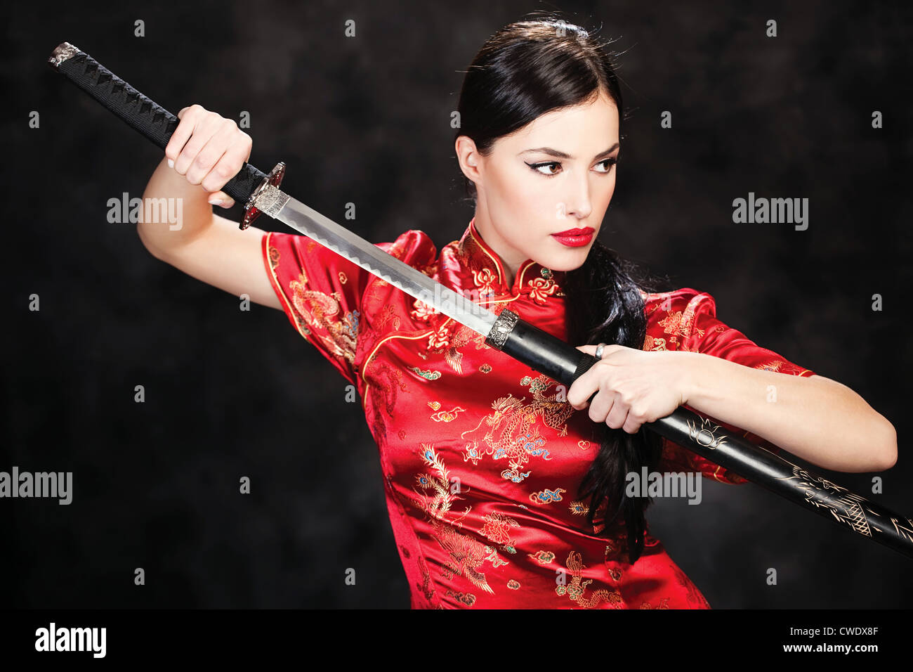 beautiful girl dressed in a kimono with katana in her hands Stock Photo