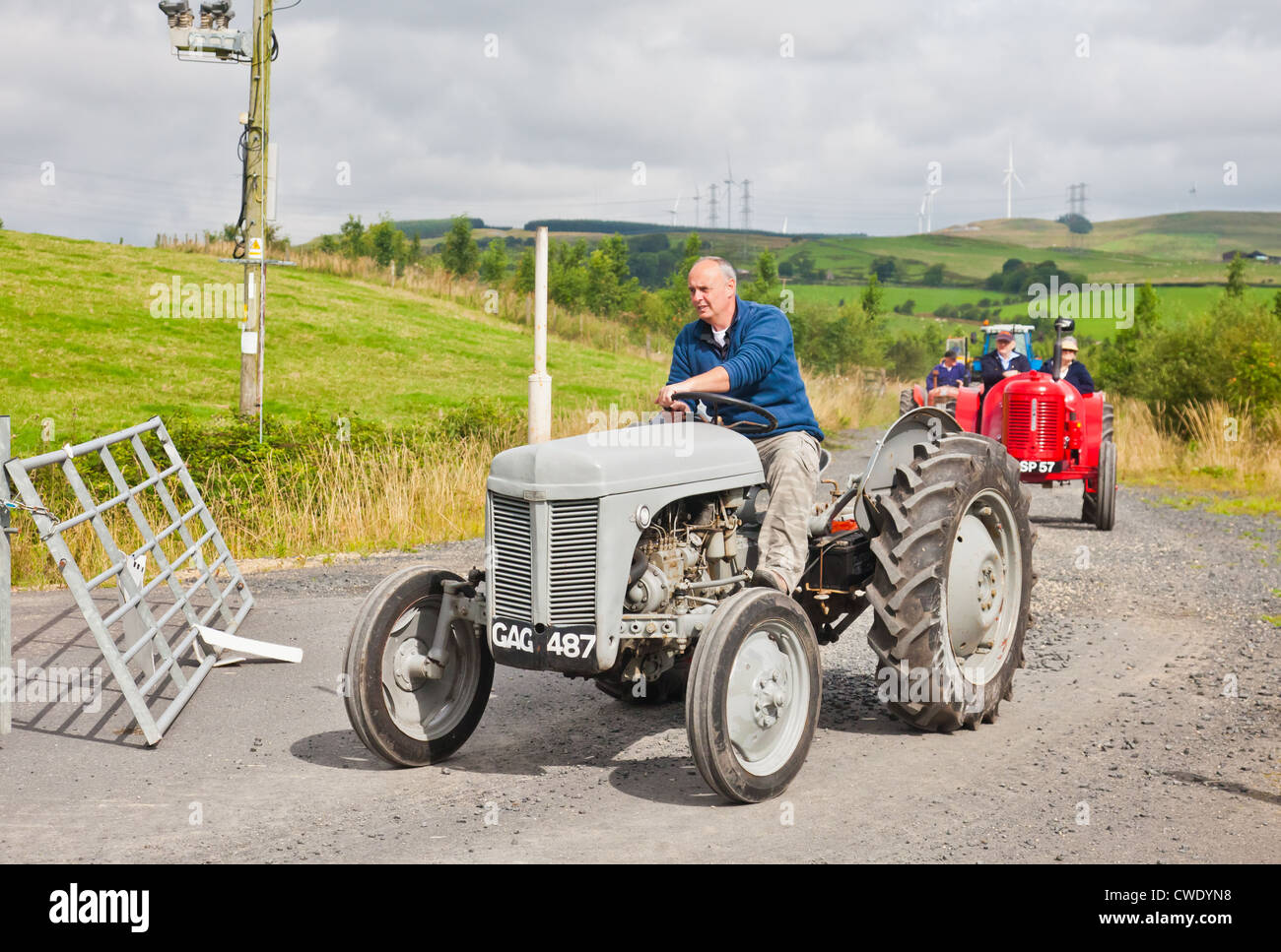 Enthusiast driving a grey vintage Ferguson TE20 tractor during an Ayrshire Vintage Tractor and Machine Club road run Stock Photo