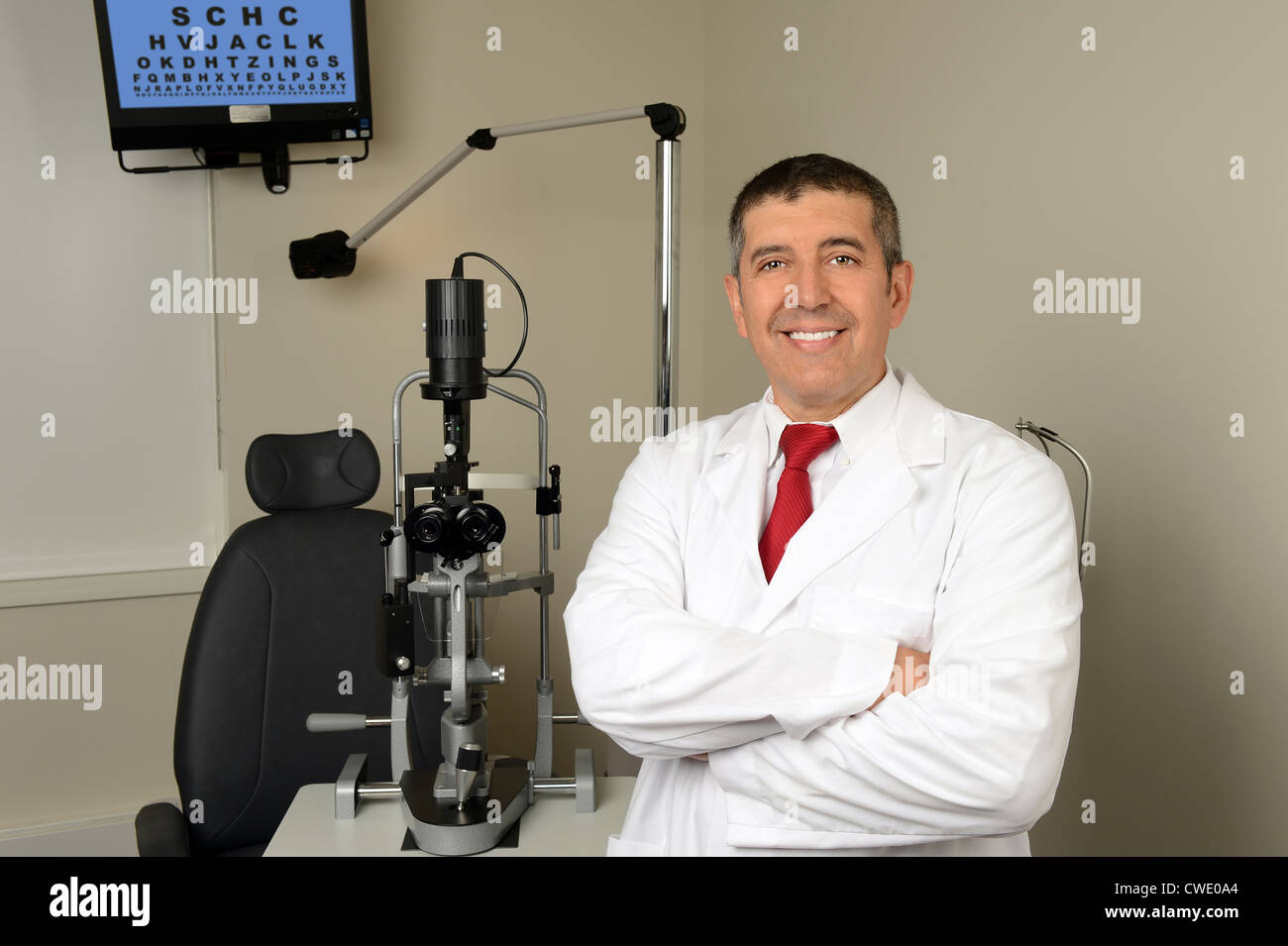 Portrait of Hispanic optician in examination room Stock Photo