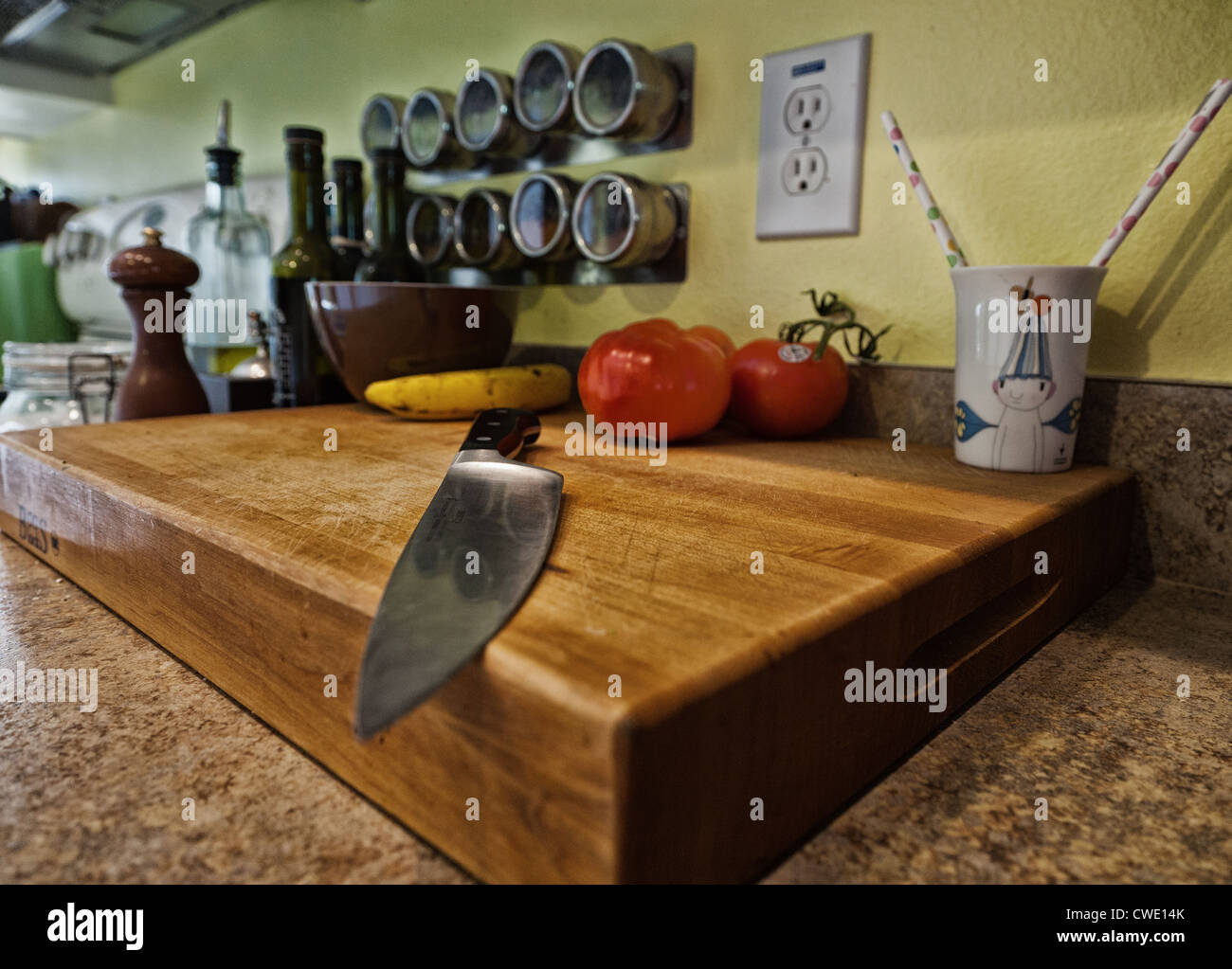 A knife on a cutting board Stock Photo