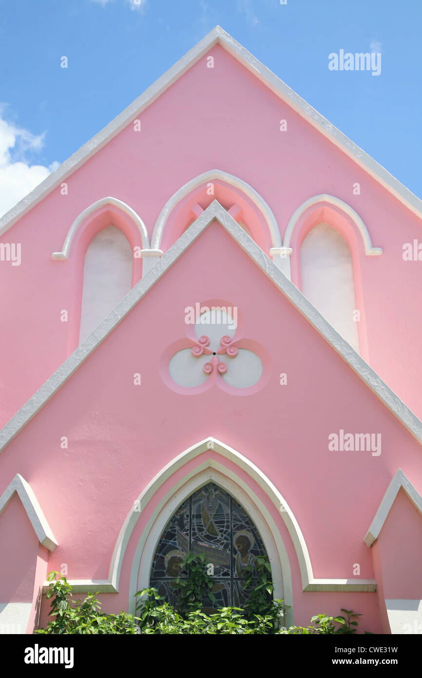 A traditional styled church in Hamilton, Bermuda with a stucco pink finish. Stock Photo