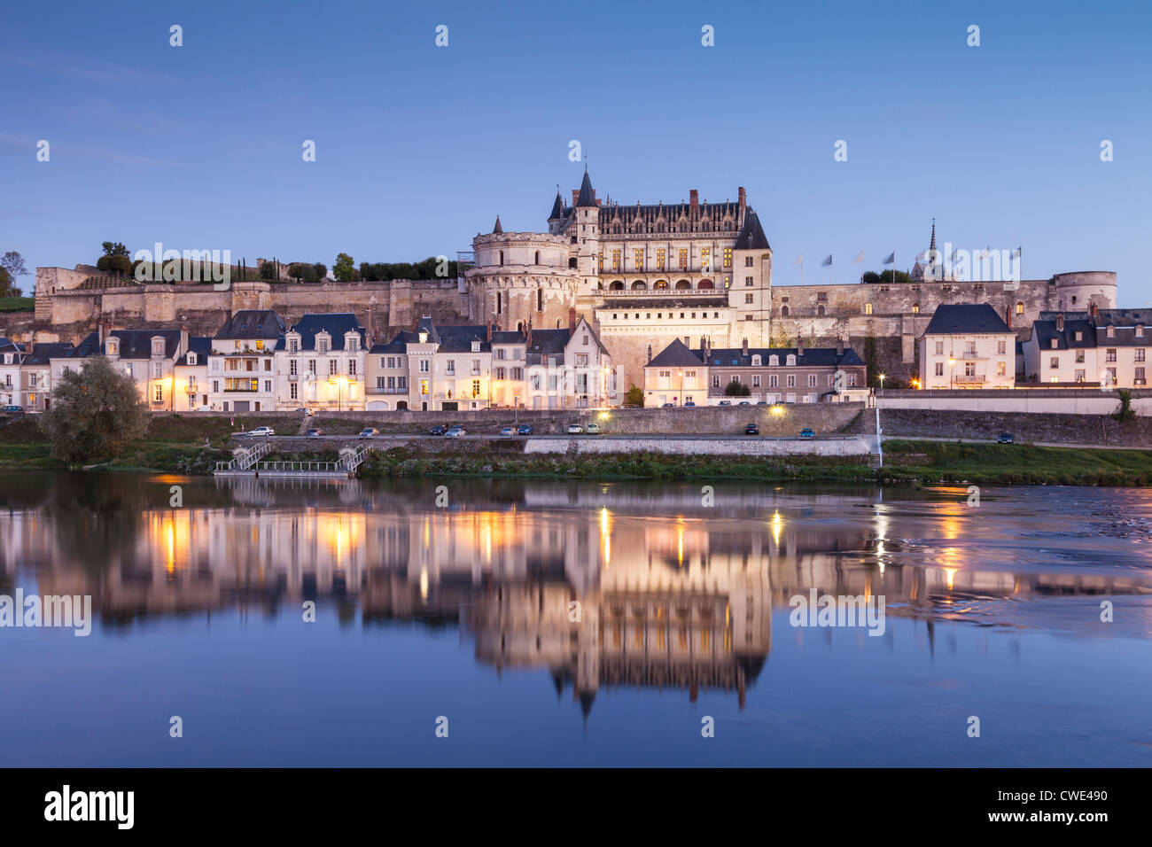 The walled town and Chateau of Amboise reflected in the River Loire in the evening. Stock Photo
