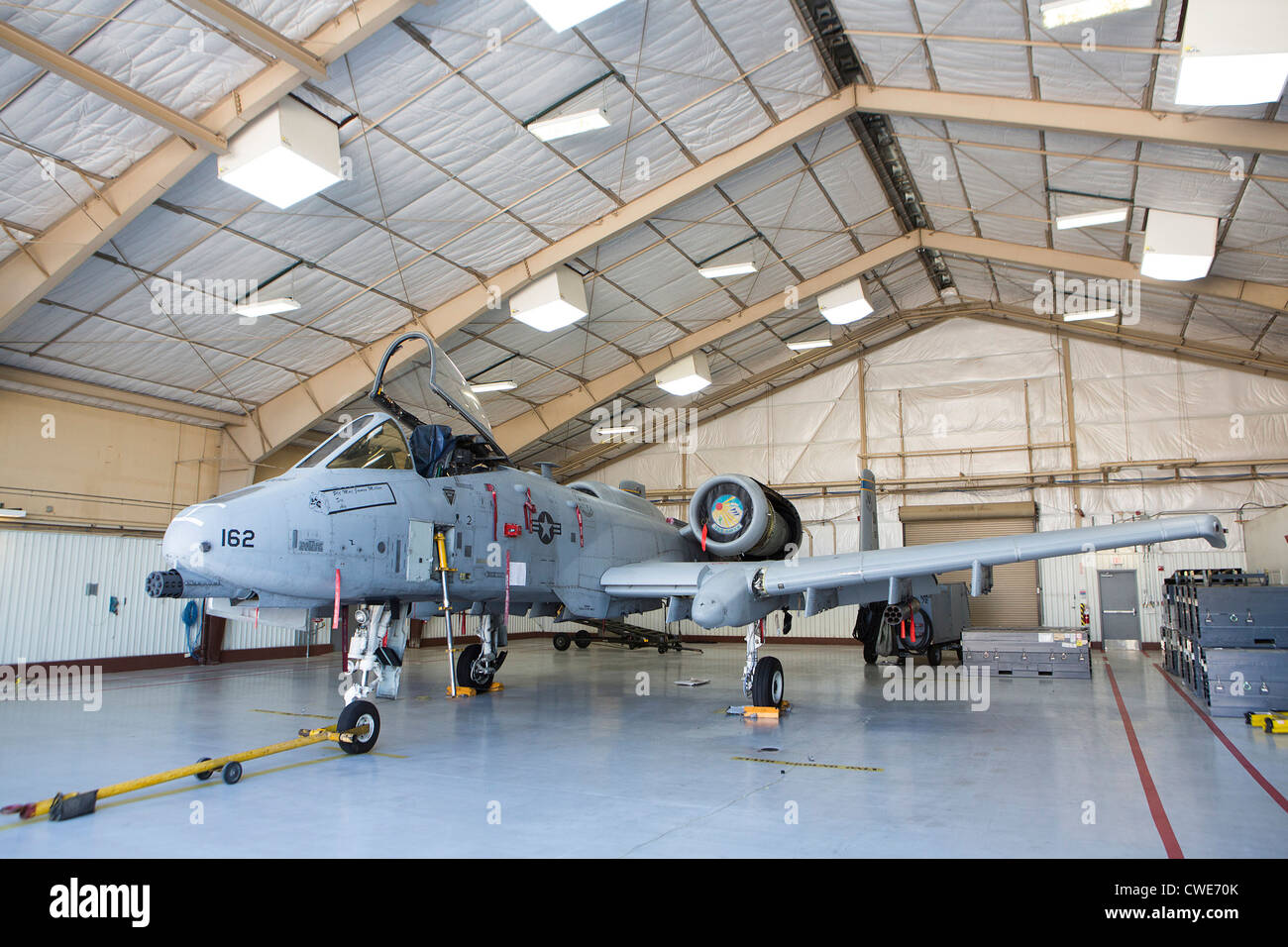 An A-10 Thunderbolt from the 354th Fighter Squadron sits parked in a hangar at Davis-Monthan Air Force Base. Stock Photo