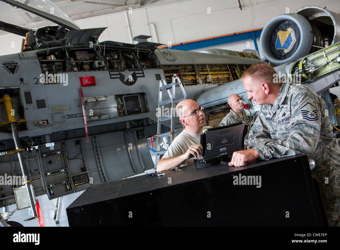 Airmen perform maintenance work on an A-10 Thunderbolt from the 354th Fighter Squadron at Davis-Monthan Air Force Base. Stock Photo