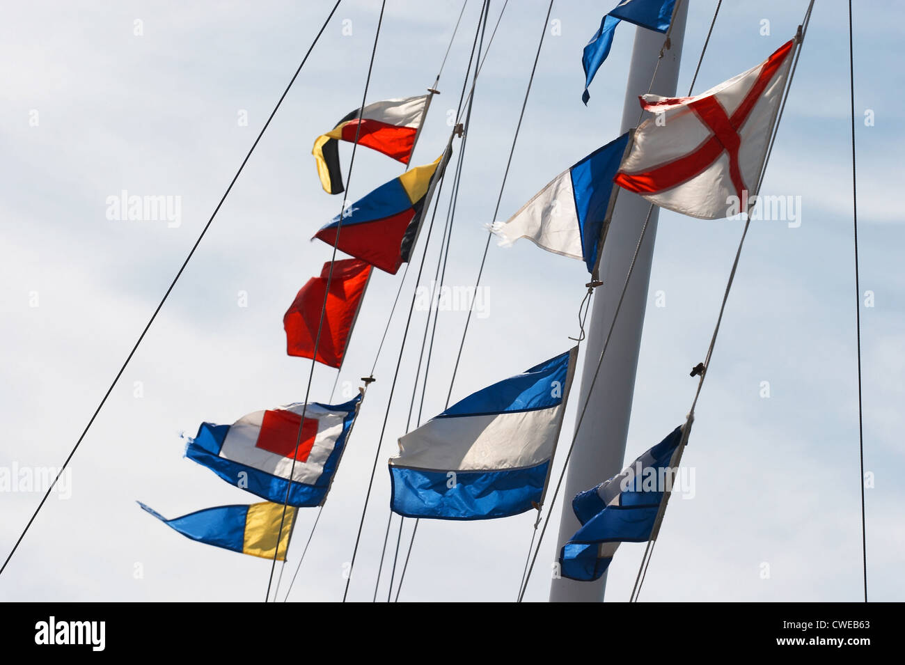 Colorful flags in the wind Stock Photo - Alamy