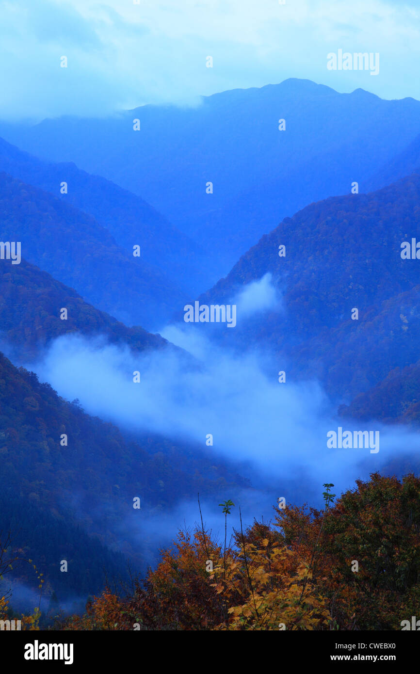 Mountain Ranges Covered By Heavy Fog, Awe Stock Photo