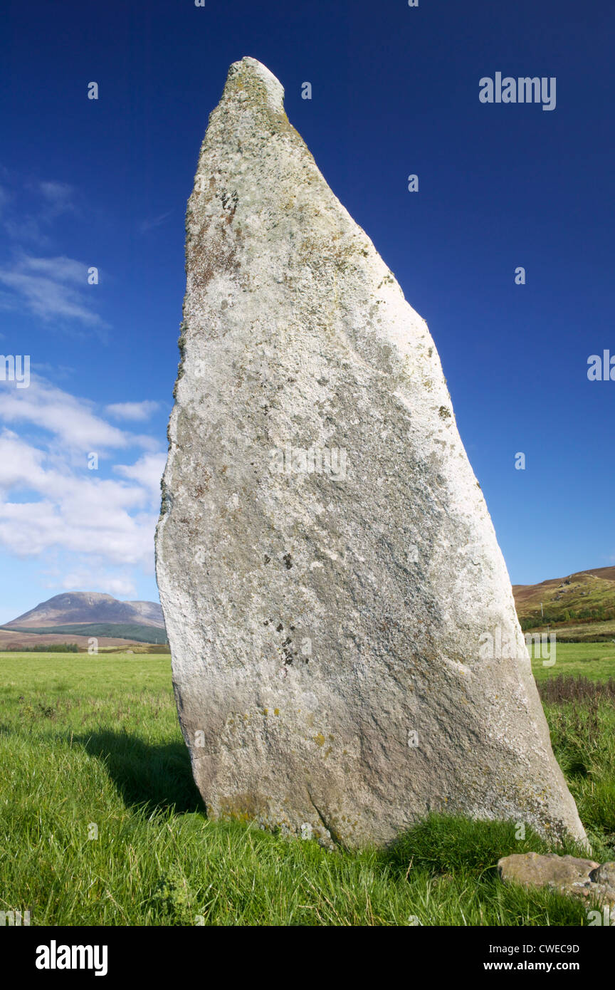 Auchencar Standing Stone, Auchencar, Isle of Arran, North Ayrshire, Scotland, UK. Beinn Bharrain in the background. Stock Photo