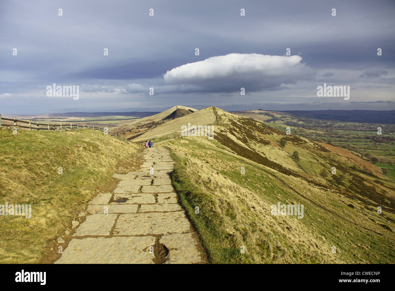 A paved path at the top of Mam Tor Castleton in the High Peak of Derbyshire, Peak District National Park, England, UK Stock Photo