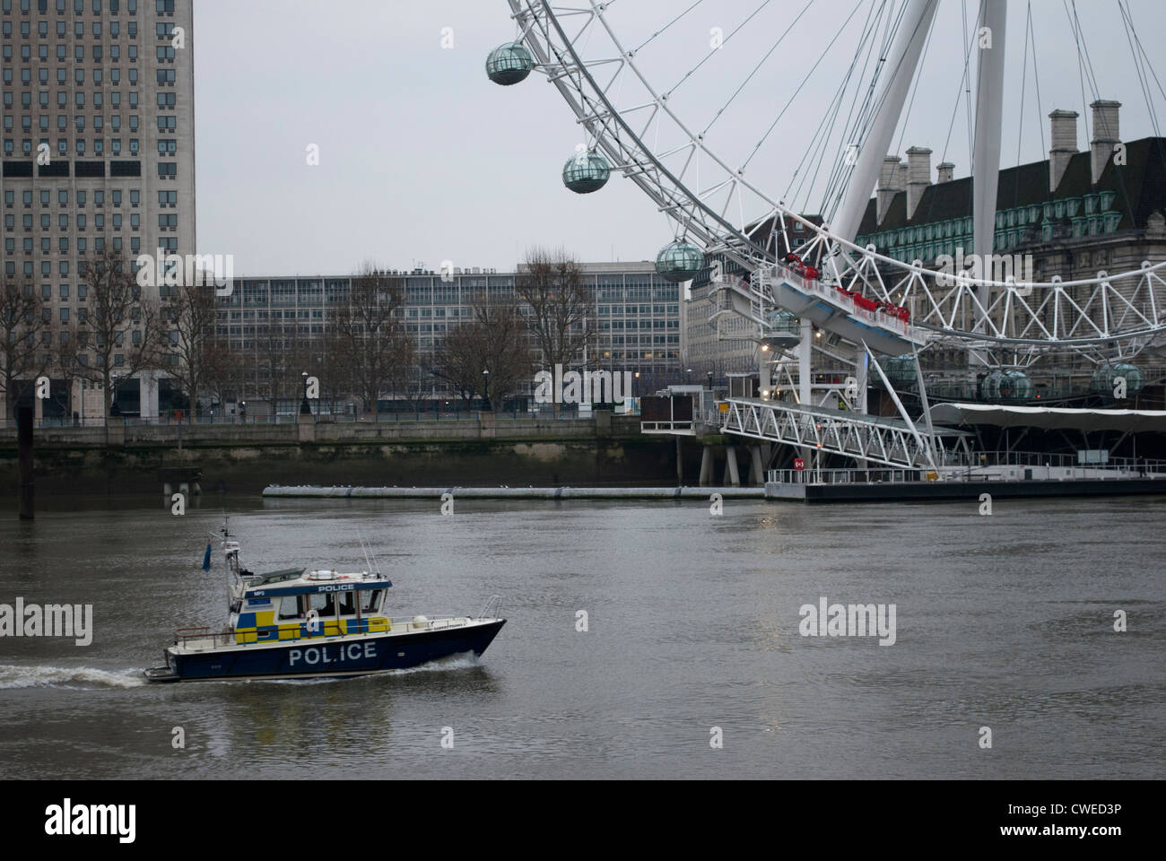 Marine Police Force boat on the River Thames with the London Eye in the background Stock Photo