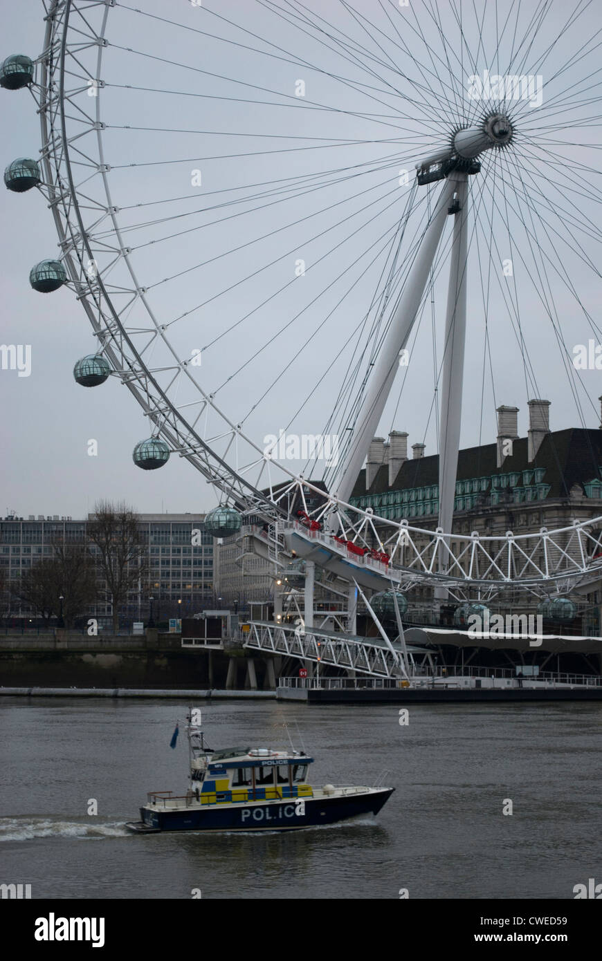 Marine Police Force boat on the River Thames with the London Eye in the background Stock Photo