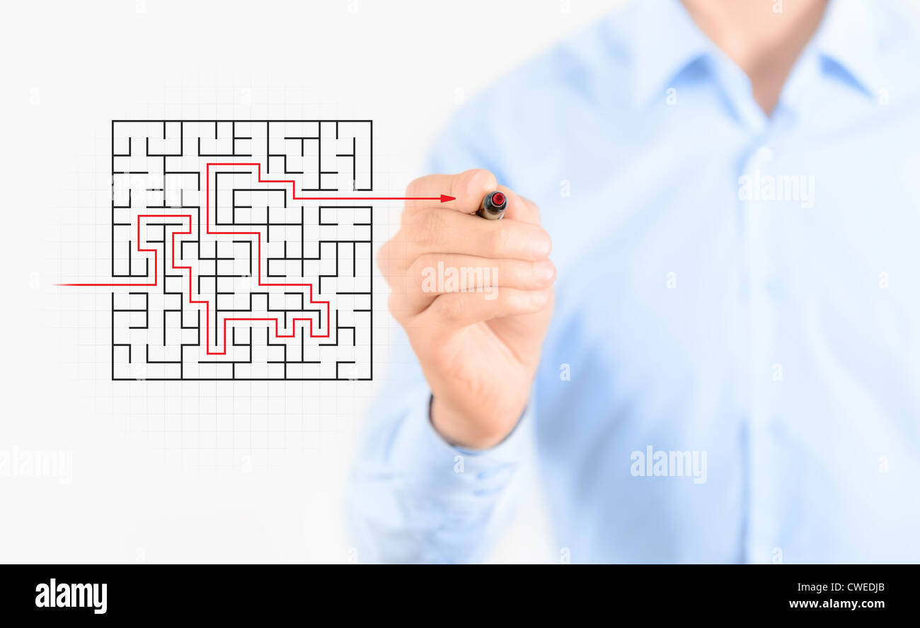 Young businessman drawing success way to find solution concept. Isolated on white. Stock Photo