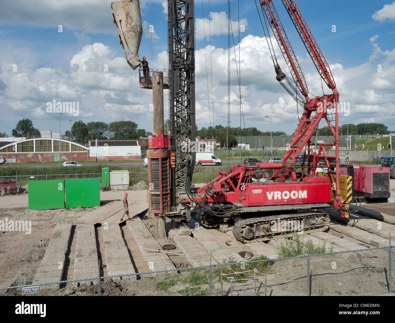Pile driver piling for construction of apartments in Cortinghborg along the ring road of Groningen. Stock Photo