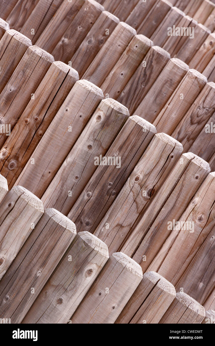 Receding angled log pole stockade, part of a children's maze at Rufford Country Park, Nottinghamshire, England, UK Stock Photo