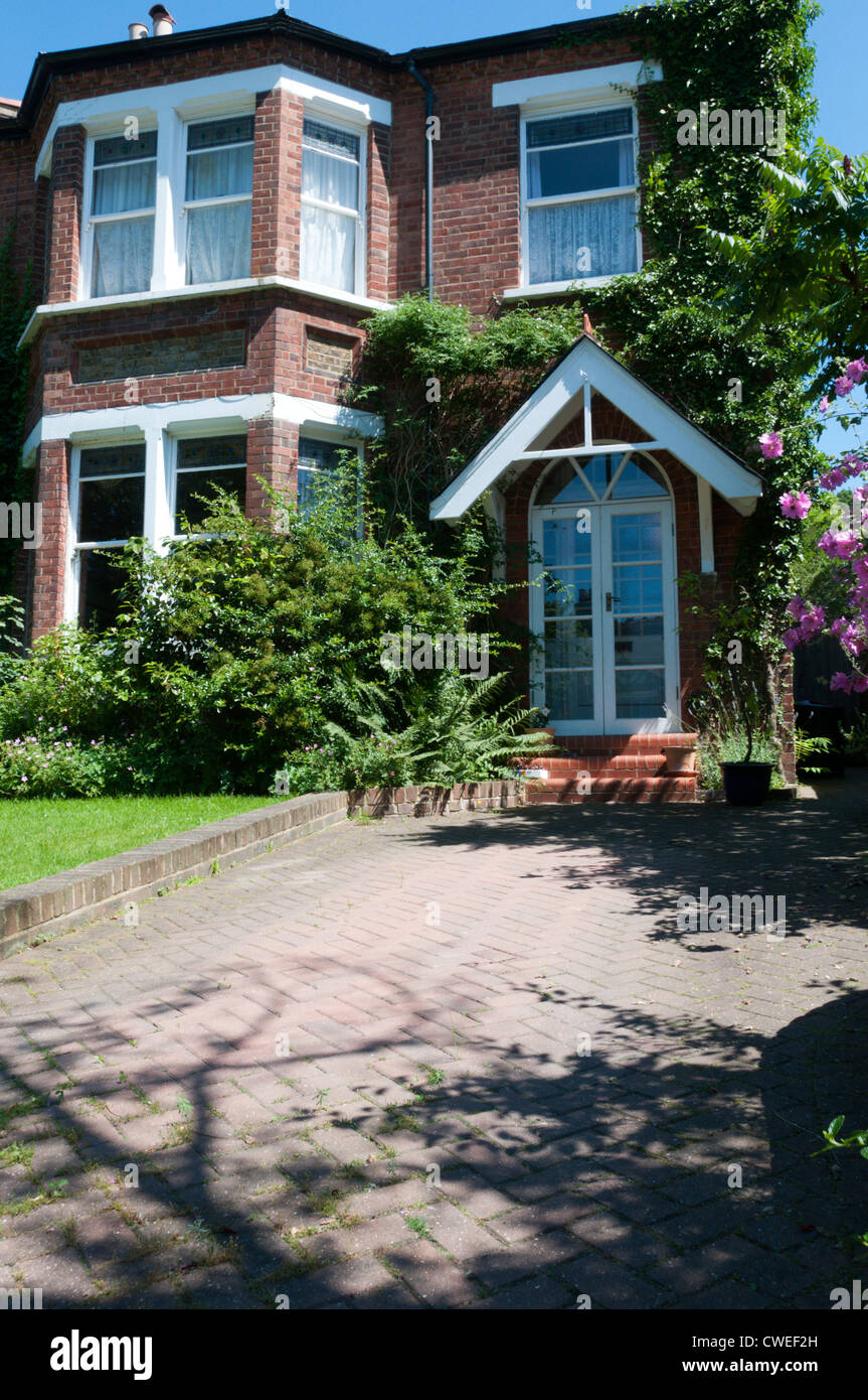 A late-nineteenth century semi-detached house in South London with a brick paved drive or pull-in. Stock Photo