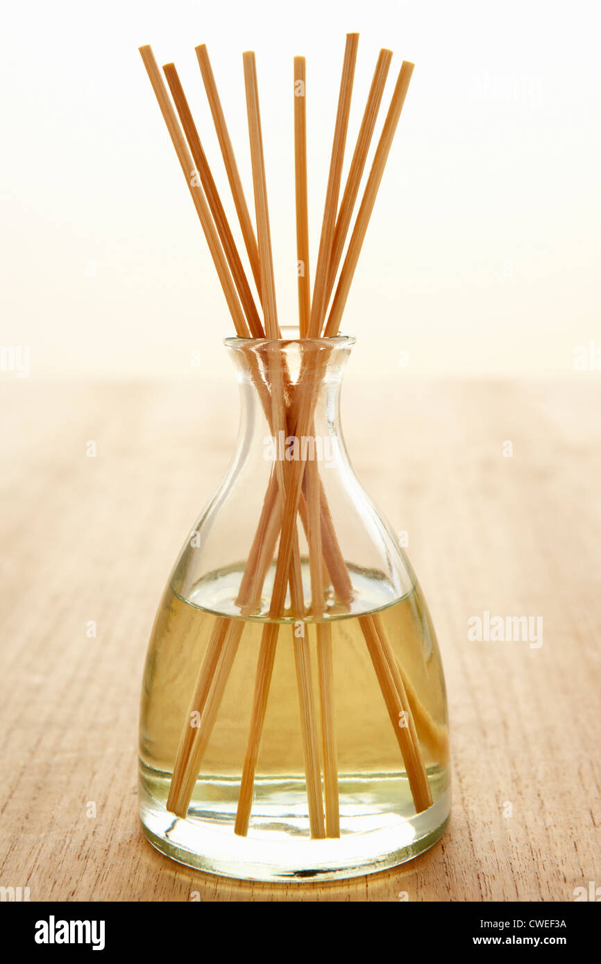 Incense sticks in carafe of water Stock Photo