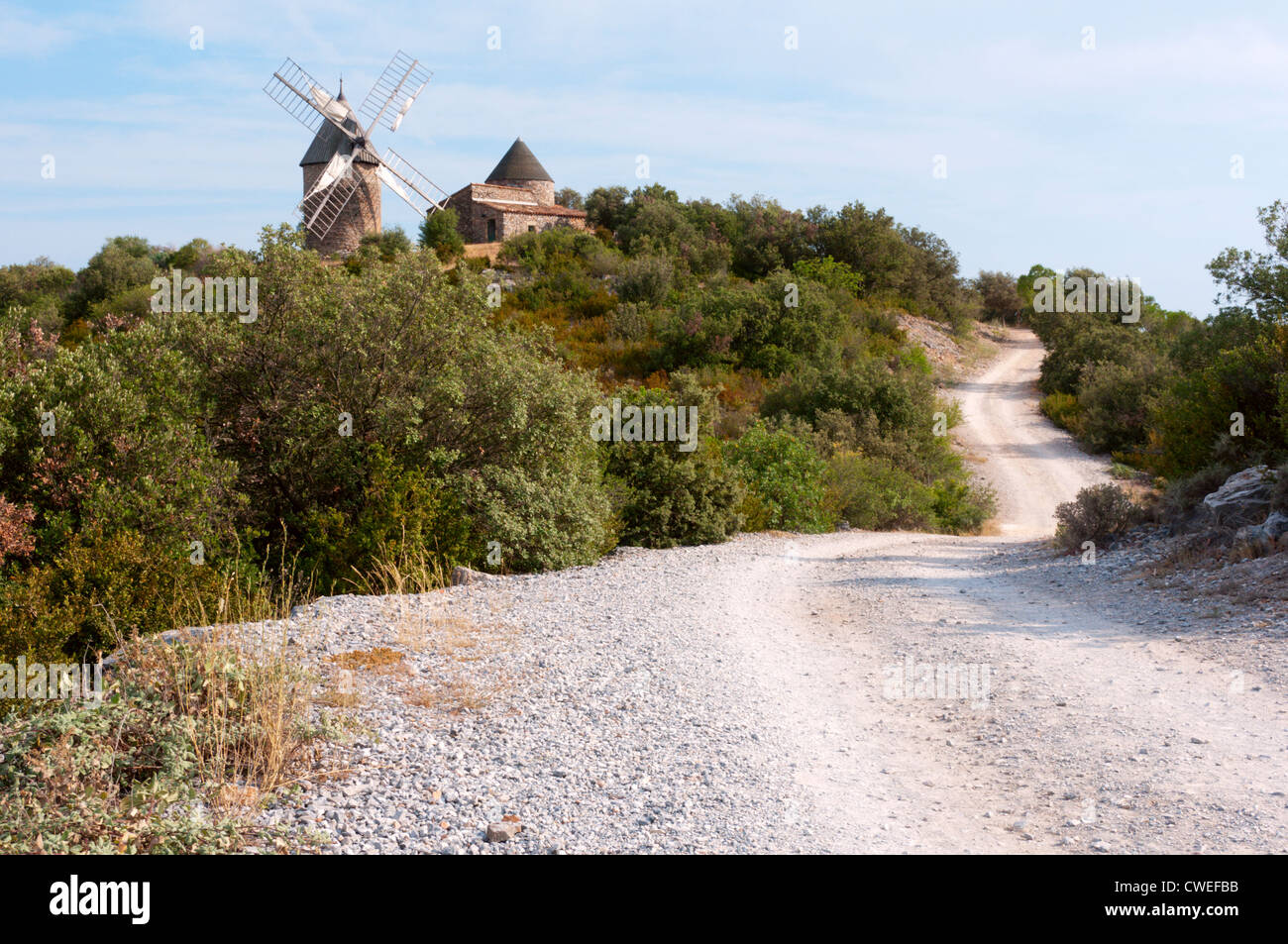 Track leading to a restored windmill near Faugeres in the Haut-Languedoc Natural Park, France. Stock Photo